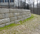 Redi-Rock retaining wall with fence